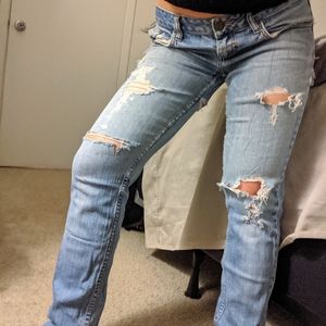 Low rise distressed straight leg/skinny jean